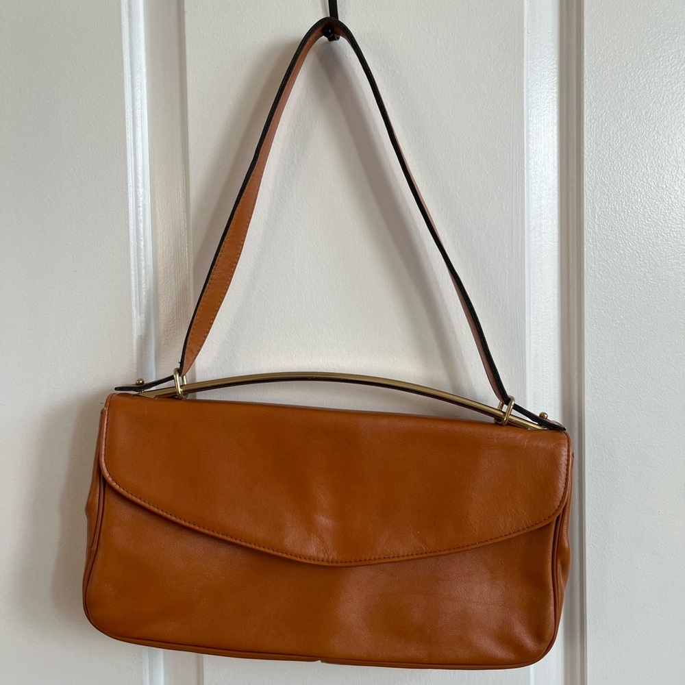 Leather shoulder bag with metal handle
